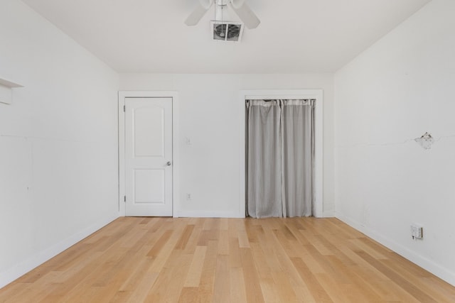 spare room with light hardwood / wood-style floors and ceiling fan