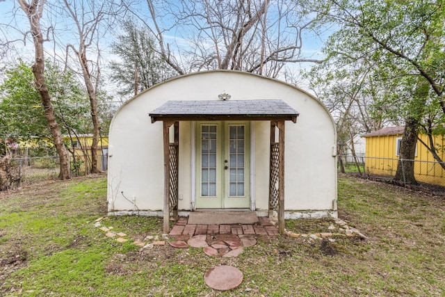 view of outbuilding with a yard