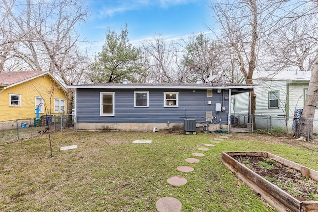 back of house with cooling unit and a lawn