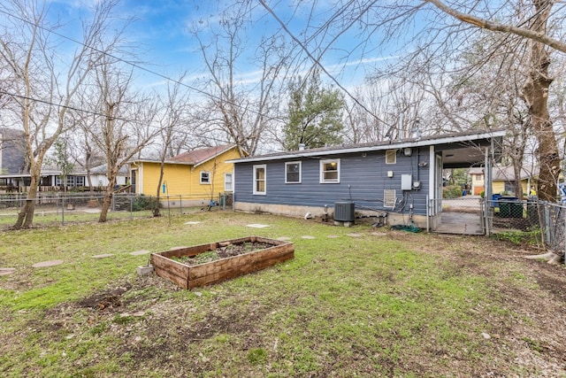 back of property with cooling unit and a lawn