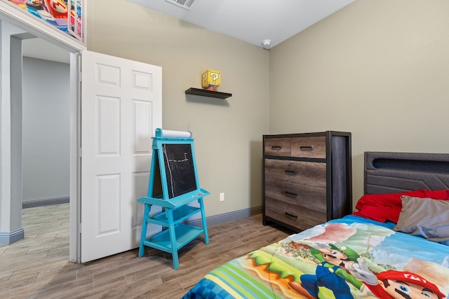 bedroom featuring light wood-type flooring