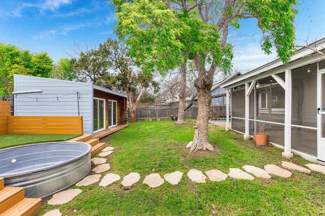 view of yard with a sunroom