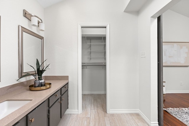 bathroom featuring vanity and hardwood / wood-style floors