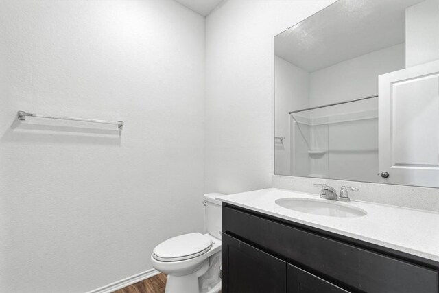 125 Mica Trl, Maxwell, TX 78656 - bathroom with wood finished floors, vanity, and a shower