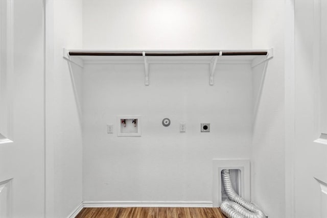 125 Mica Trl, Maxwell, TX 78656 - clothes washing area featuring hookup for an electric dryer, gas dryer hookup, wood finished floors, and washer hookup