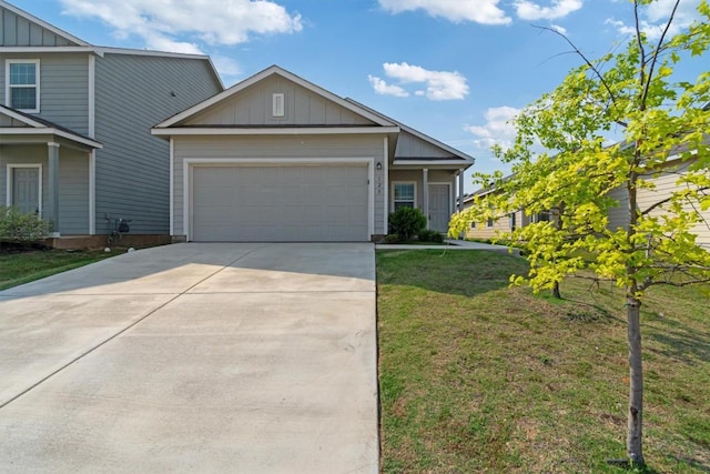 125 Mica Trl, Maxwell, TX 78656 - view of front of property with board and batten siding, a garage, driveway, and a front lawn