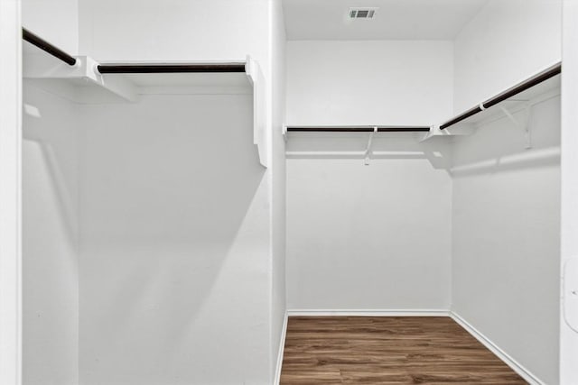 125 Mica Trl, Maxwell, TX 78656 - walk in closet with wood finished floors