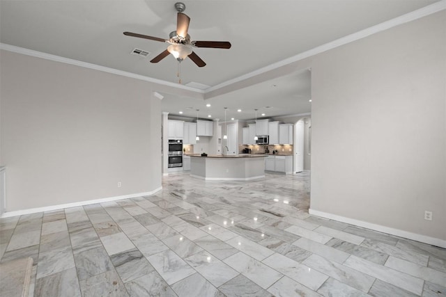 unfurnished living room with crown molding, sink, and ceiling fan