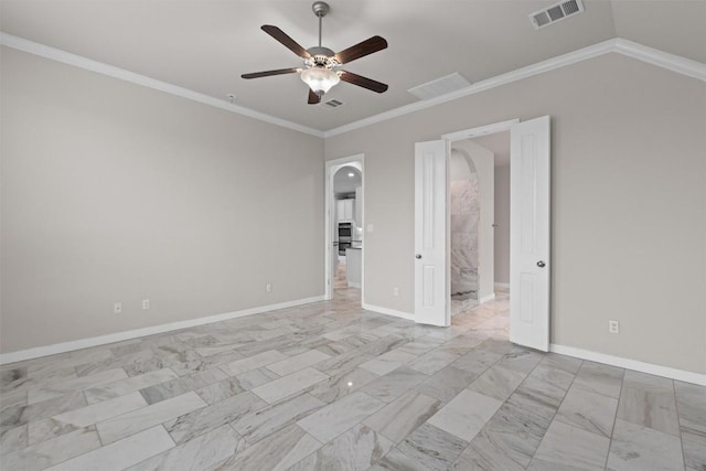 spare room with lofted ceiling, ornamental molding, and ceiling fan