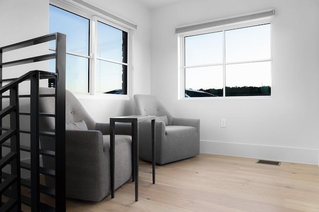 sitting room with light hardwood / wood-style floors