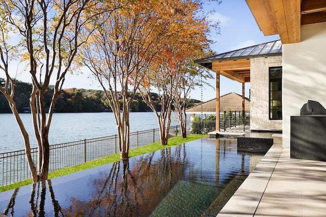 dock area featuring a gazebo and a water view