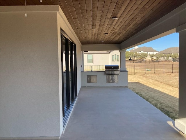 view of patio / terrace with area for grilling, a grill, and a mountain view