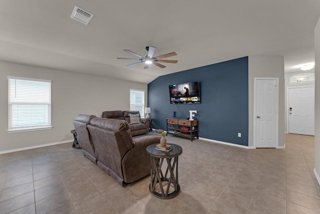 living room featuring ceiling fan, visible vents, and baseboards