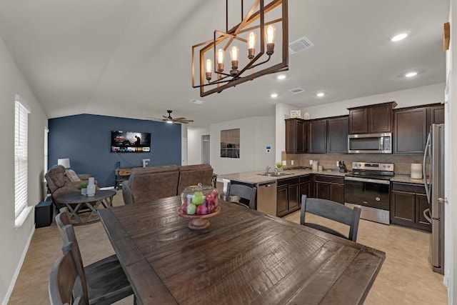 dining space with visible vents, vaulted ceiling, a ceiling fan, and recessed lighting