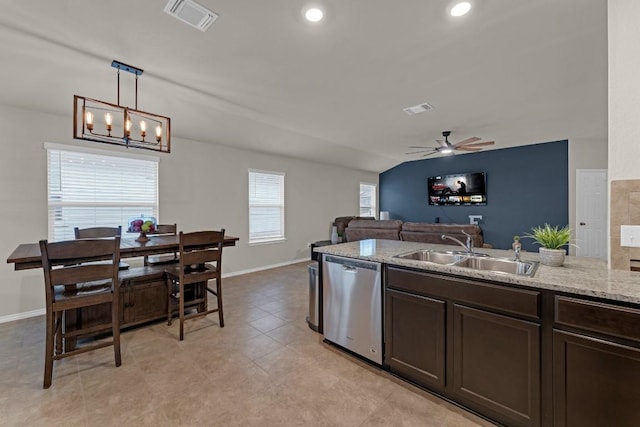 kitchen with stainless steel dishwasher, a sink, visible vents, and dark brown cabinetry