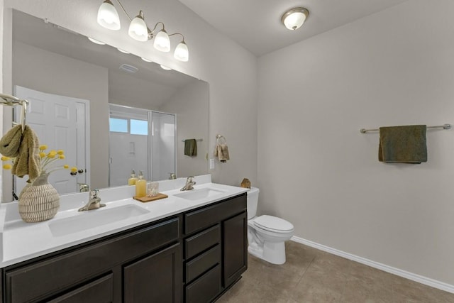 full bathroom featuring a stall shower, a sink, toilet, and tile patterned floors