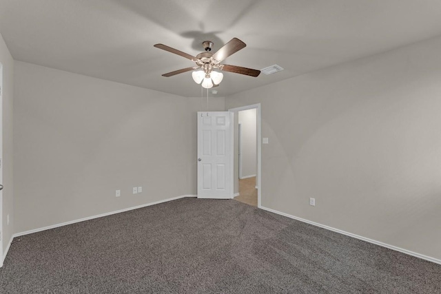 empty room featuring visible vents, baseboards, ceiling fan, and carpet flooring