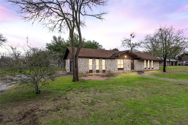 view of front of property with a lawn