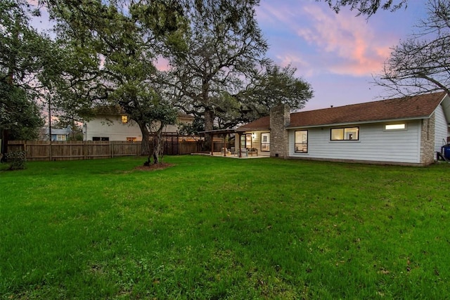 5102 Summerset Trl, Austin, TX 78749 - yard at dusk featuring a patio