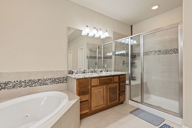 bathroom featuring tile patterned floors, vanity, and separate shower and tub