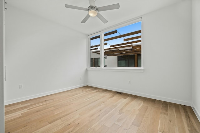 unfurnished room with ceiling fan and light hardwood / wood-style floors