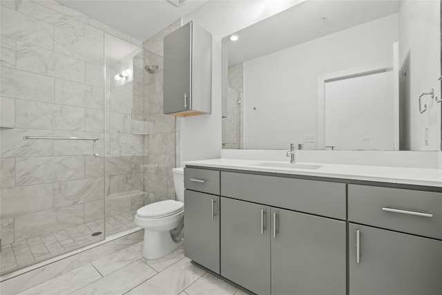 bathroom with vanity, toilet, and walk in shower