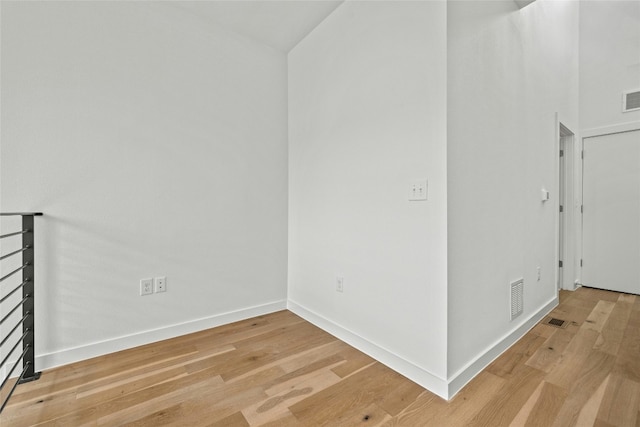 empty room with hardwood / wood-style floors