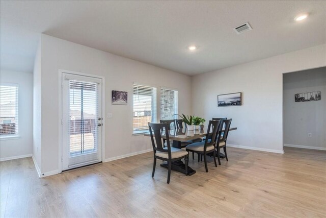 2501 Bear Juice Vw, Leander, TX 78641 - dining space featuring light wood-style floors, plenty of natural light, baseboards, and recessed lighting