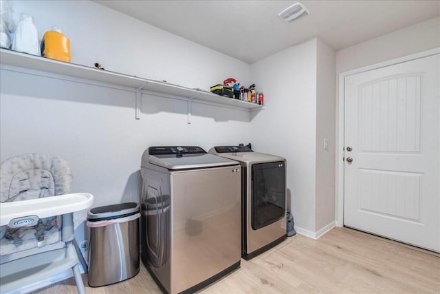 2501 Bear Juice Vw, Leander, TX 78641 - laundry area featuring separate washer and dryer, light wood-style floors, and baseboards