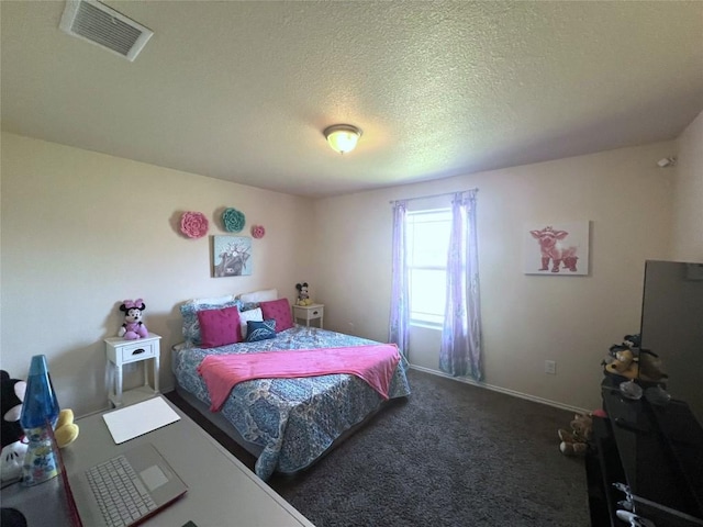 carpeted bedroom featuring a textured ceiling