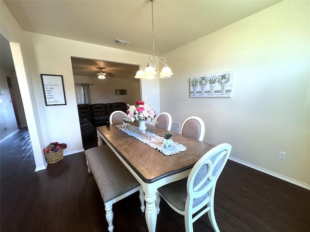 dining room featuring dark hardwood / wood-style flooring and lofted ceiling