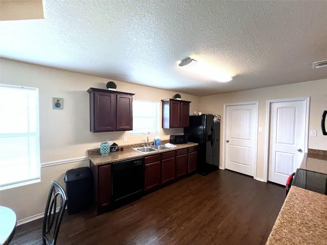 kitchen with dark brown cabinetry, sink, black appliances, and dark hardwood / wood-style floors