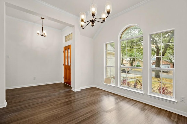 unfurnished dining area featuring a chandelier, dark wood-type flooring, baseboards, and crown molding