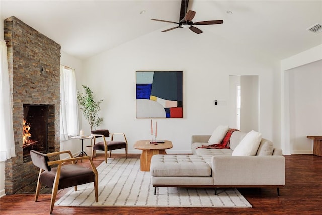 living room with hardwood / wood-style flooring, a fireplace, ceiling fan, and vaulted ceiling