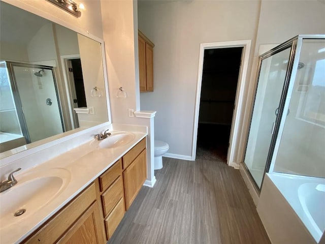 full bathroom featuring vanity, toilet, independent shower and bath, and hardwood / wood-style floors