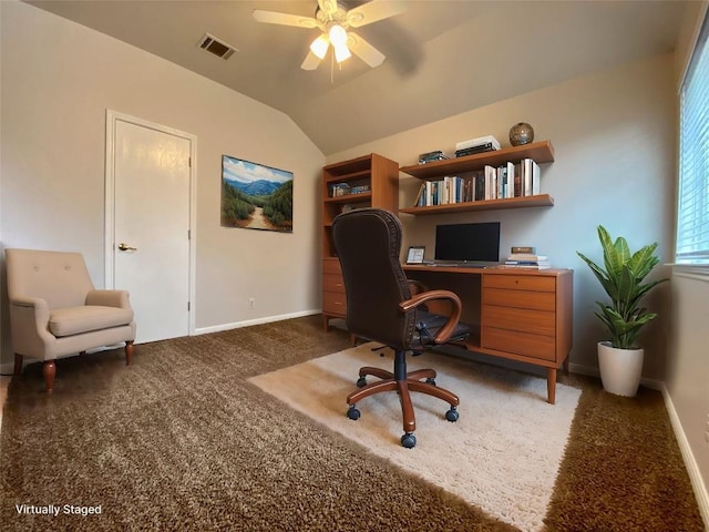 carpeted home office featuring vaulted ceiling and ceiling fan