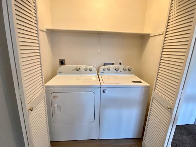 laundry room featuring washing machine and clothes dryer