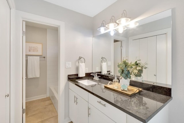 bathroom featuring tile patterned floors, vanity, and bathtub / shower combination