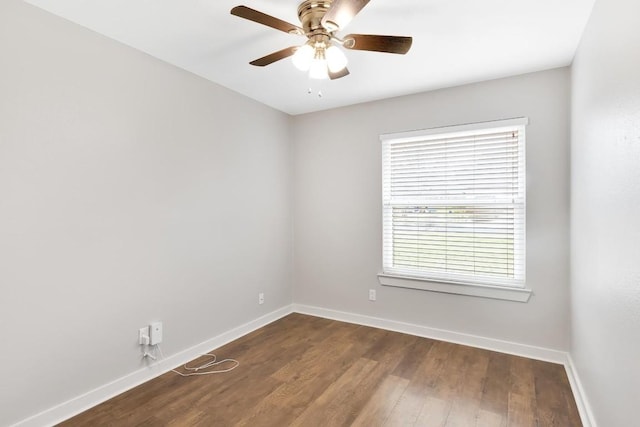 spare room with hardwood / wood-style floors and ceiling fan