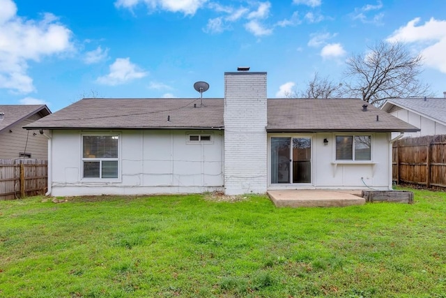 back of house featuring a yard and a patio