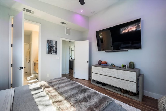 bedroom featuring dark hardwood / wood-style flooring and ceiling fan