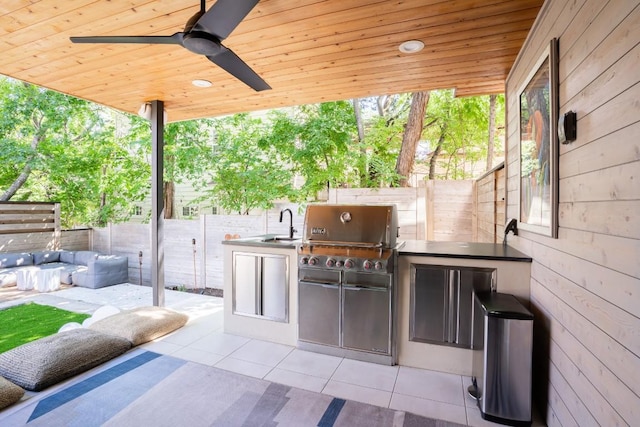 view of patio / terrace with sink, area for grilling, ceiling fan, a grill, and an outdoor hangout area