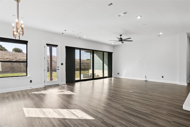 unfurnished room featuring dark wood-type flooring and ceiling fan