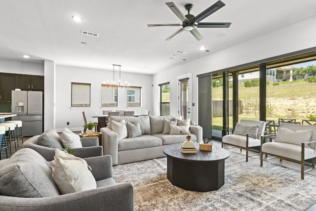 313 Starfire Dr, Dripping Springs, TX 78620 - living area featuring a chandelier, recessed lighting, and a ceiling fan