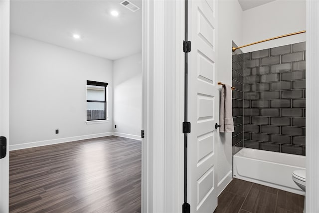 313 Starfire Dr, Dripping Springs, TX 78620 - full bathroom featuring wood finished floors, toilet,  shower combination, baseboards, and recessed lighting