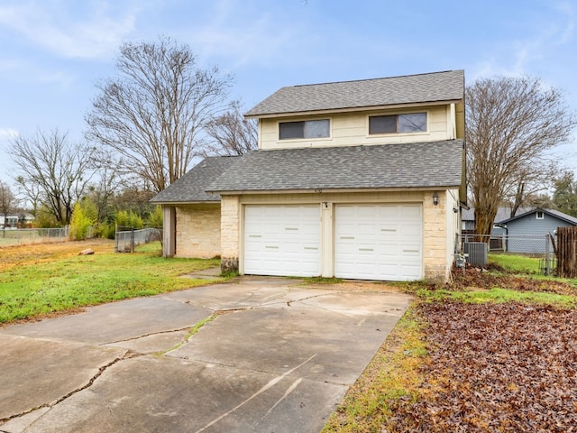 garage with central air condition unit, fence, and concrete driveway