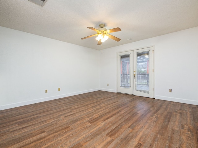 unfurnished room with dark hardwood / wood-style floors, a textured ceiling, ceiling fan, and french doors