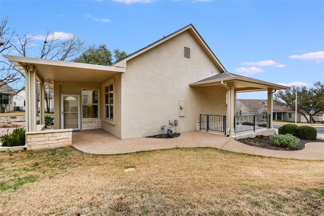 rear view of house with a yard