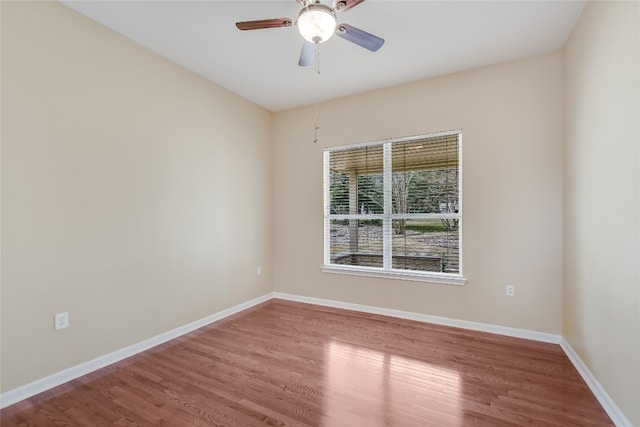 spare room featuring ceiling fan and wood-type flooring