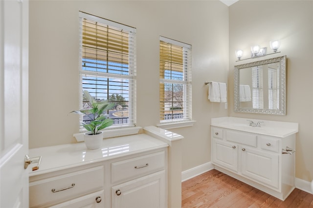 bathroom with vanity and hardwood / wood-style floors